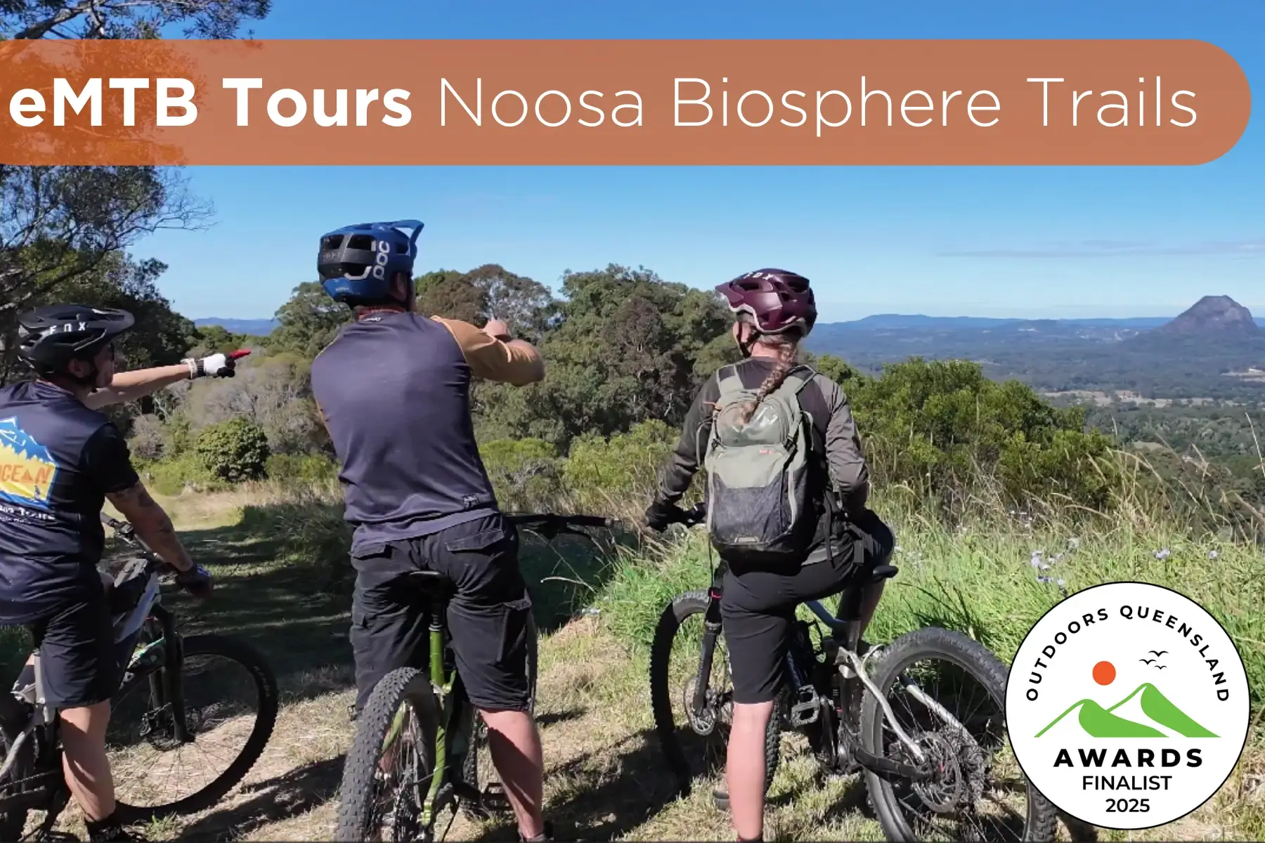 View from a lookout on the Noosa Biosphere EMTB tour with award winning logo
