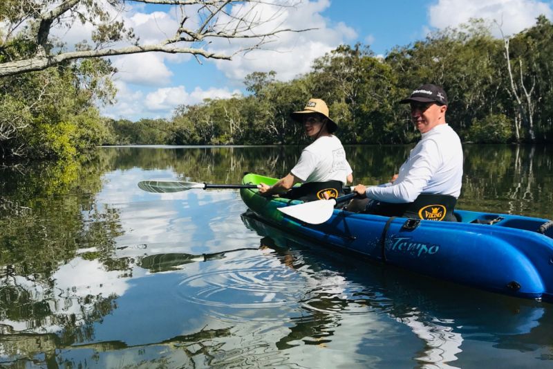 Kayaks on reflective waters in the Noosa Everglades