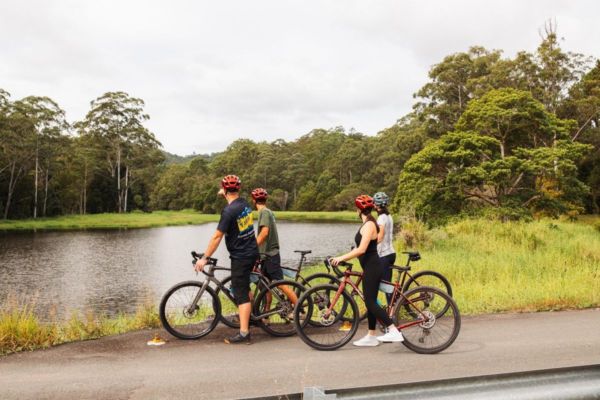 Riders exploring quiet gravel roads near Kin Kin in the Noosa Biosphere