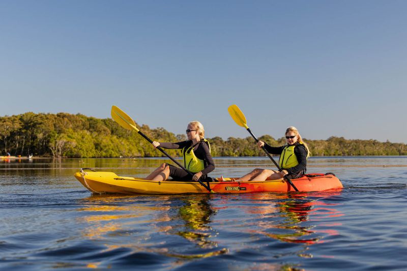 two women kayaking in noosa