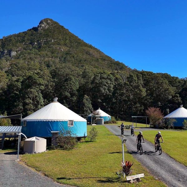 Riders arriving past the yurts at Noosa Eco Retreat under Mt Cooroora, Pomona