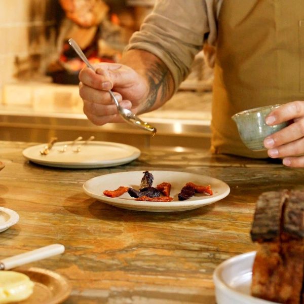 Chef plating a degustation course, Noosa Hinterland farm-to-plate dining